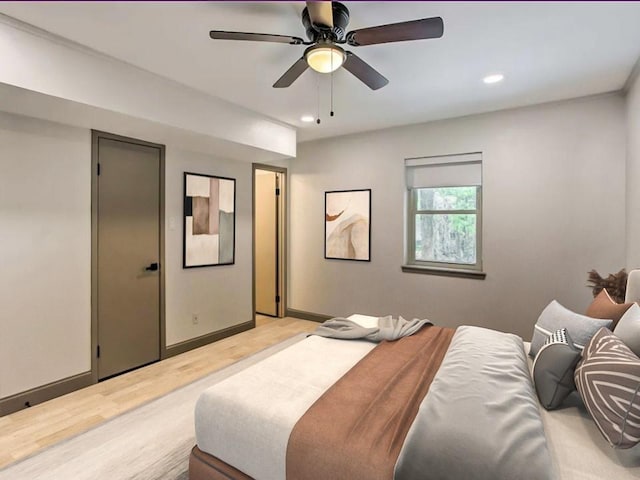 bedroom featuring ceiling fan and light wood-type flooring