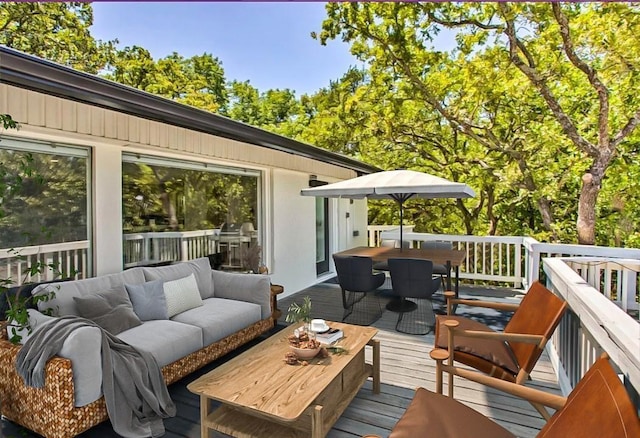 wooden terrace with an outdoor living space