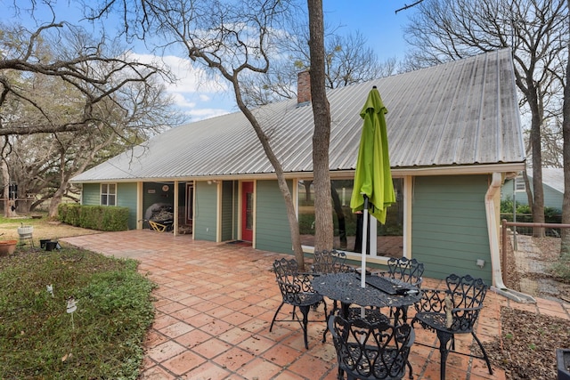 rear view of property featuring a patio