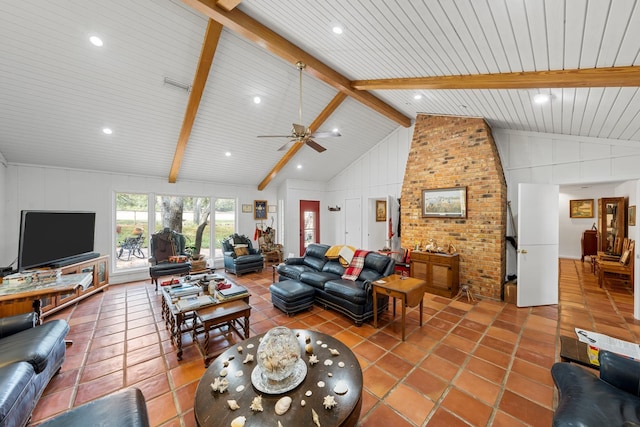 tiled living room featuring lofted ceiling with beams and brick wall