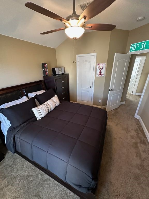 bedroom featuring ceiling fan, lofted ceiling, and carpet flooring