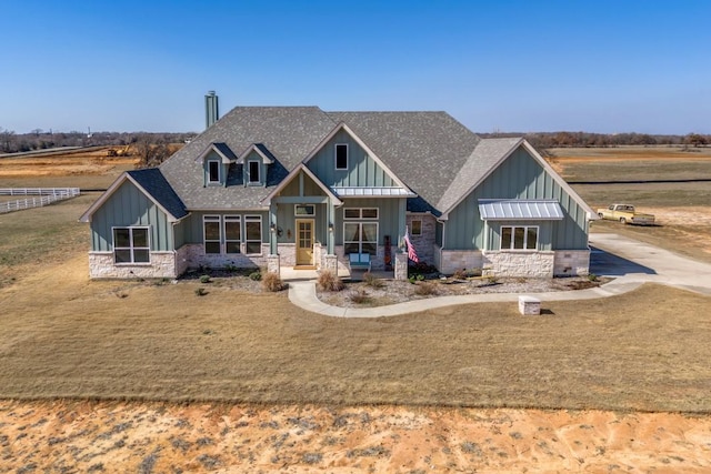 craftsman inspired home with a front yard and covered porch