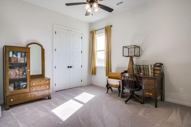 office area with light carpet and ceiling fan