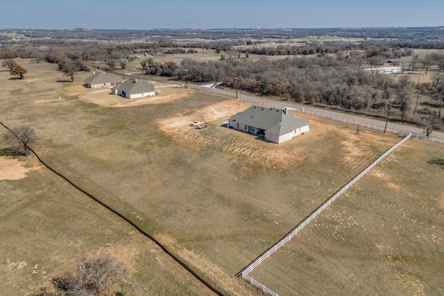 birds eye view of property with a rural view