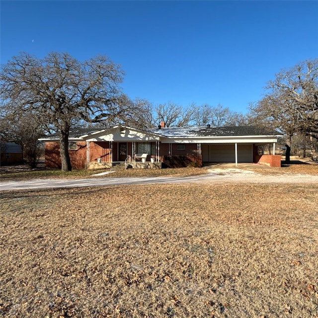 ranch-style house with a carport