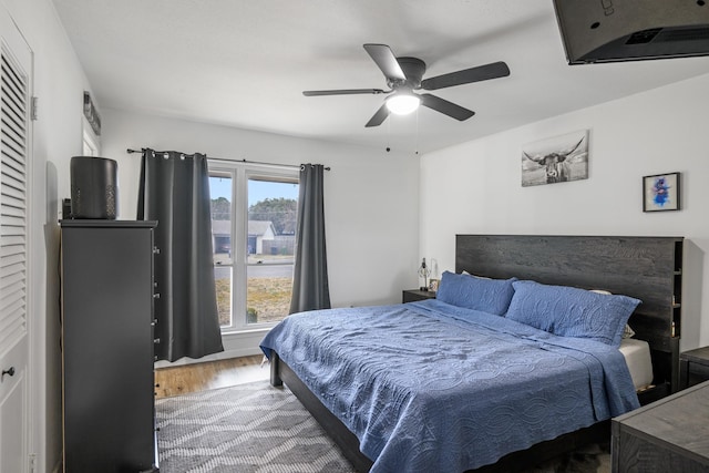 bedroom featuring ceiling fan and wood-type flooring