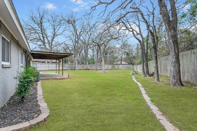 view of yard featuring a wooden deck