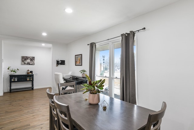 dining space with dark wood-type flooring