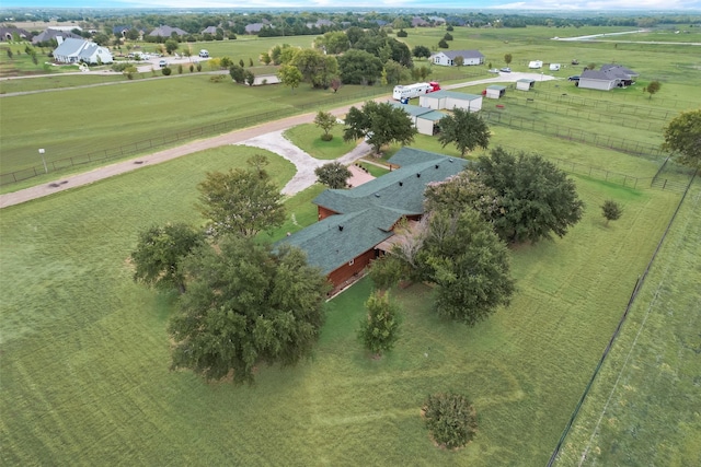 birds eye view of property with a rural view