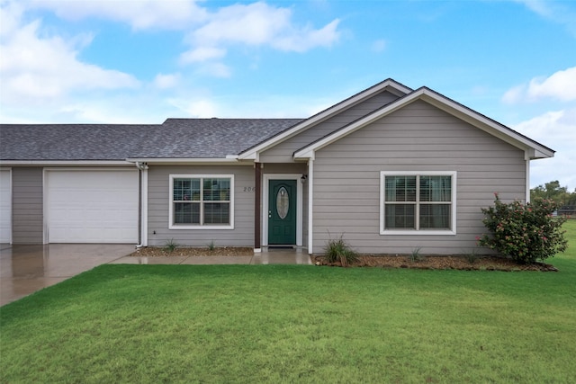 single story home featuring a garage and a front lawn