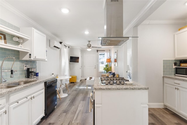 kitchen featuring sink, white cabinetry, island range hood, an AC wall unit, and dishwasher