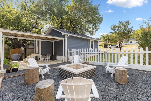 view of patio with a fire pit