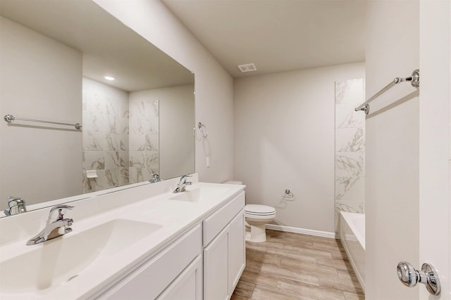 716 Tawny Turn, Lavon, TX 75166 - full bathroom with visible vents, a sink, double vanity, and toilet