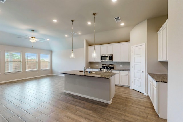 716 Tawny Turn, Lavon, TX 75166 - kitchen with ceiling fan, decorative backsplash, appliances with stainless steel finishes, a sink, and lofted ceiling