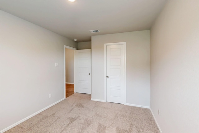 716 Tawny Turn, Lavon, TX 75166 - unfurnished bedroom with carpet floors, baseboards, and visible vents