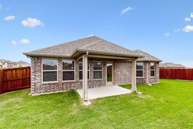 716 Tawny Turn, Lavon, TX 75166 - back of property with a yard, brick siding, a patio, and a fenced backyard