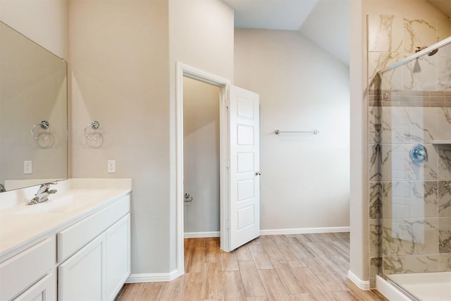 716 Tawny Turn, Lavon, TX 75166 - full bath featuring a shower stall, wood finished floors, lofted ceiling, and vanity