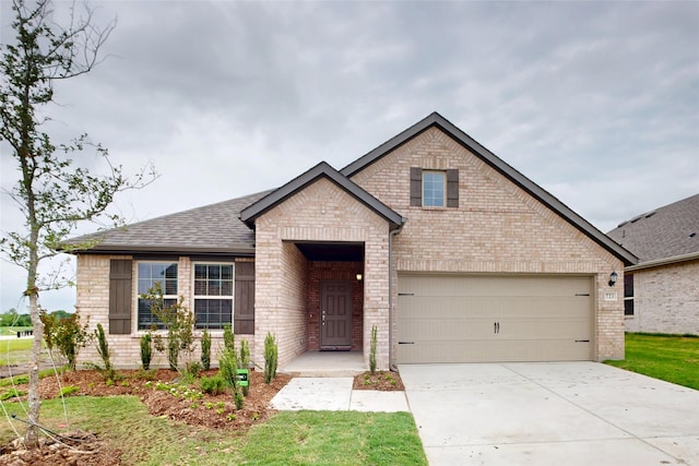 721 Merry Summit Rd, Lavon, TX 75166 - view of front of property featuring brick siding, concrete driveway, a garage, and roof with shingles
