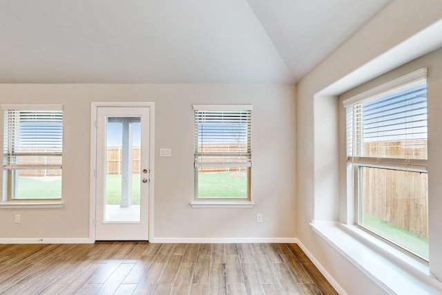 721 Merry Summit Rd, Lavon, TX 75166 - doorway with wood finished floors, plenty of natural light, vaulted ceiling, and baseboards