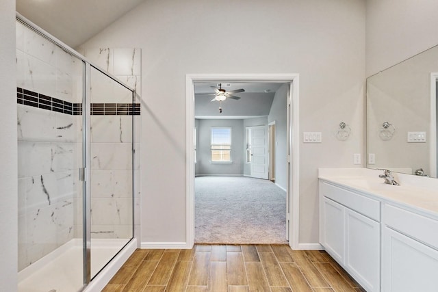 721 Merry Summit Rd, Lavon, TX 75166 - bathroom featuring baseboards, a stall shower, wood finish floors, ceiling fan, and vanity