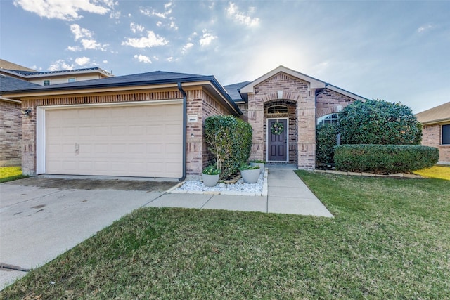 view of front of home with a garage and a front lawn