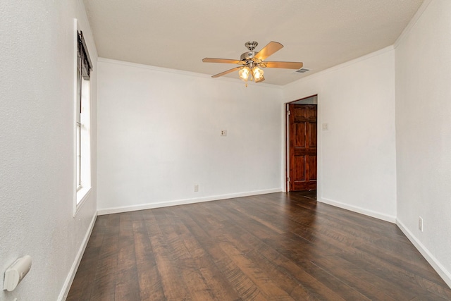 unfurnished room with dark wood-type flooring, ornamental molding, and ceiling fan