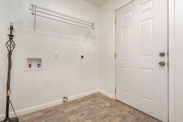 laundry area featuring electric dryer hookup, hookup for a washing machine, and wood-type flooring