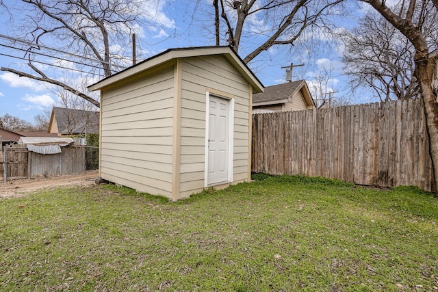 view of outbuilding featuring a lawn