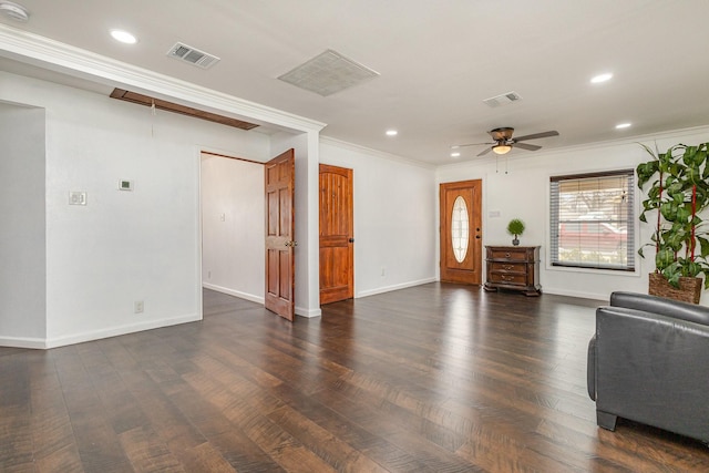 living room featuring crown molding, dark wood-type flooring, and ceiling fan