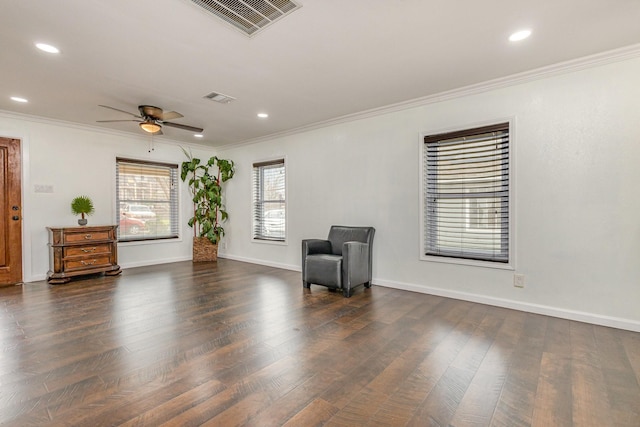 unfurnished room with crown molding, ceiling fan, and dark hardwood / wood-style floors