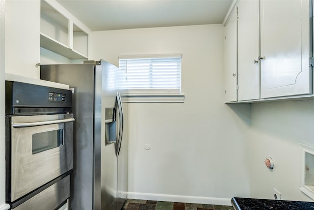 kitchen featuring white cabinets and appliances with stainless steel finishes