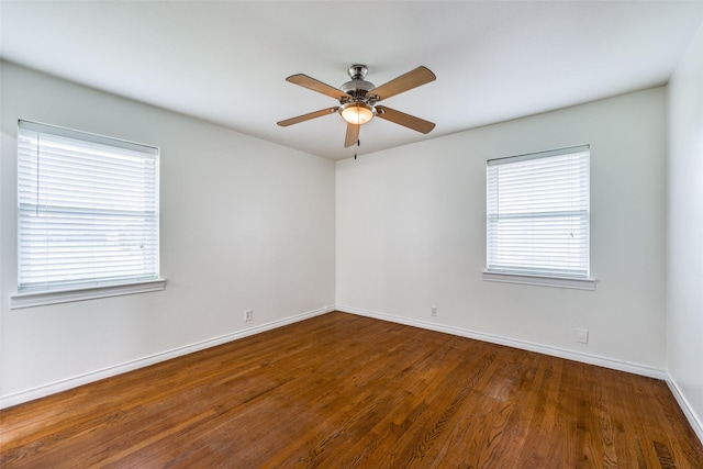 empty room featuring dark hardwood / wood-style floors and ceiling fan