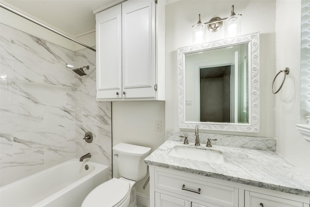 full bathroom featuring vanity, tiled shower / bath combo, and toilet