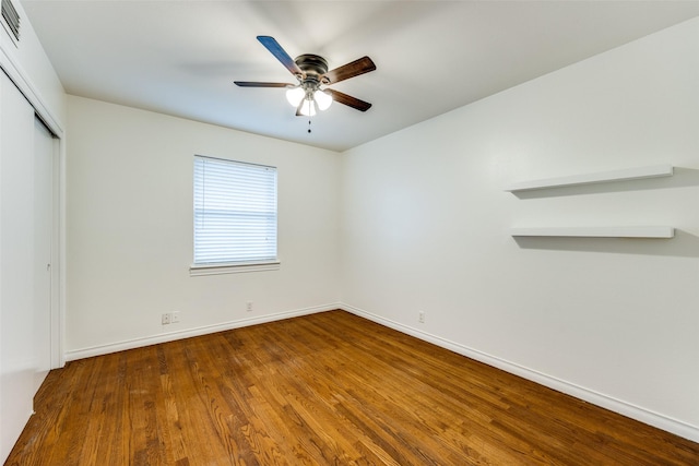 unfurnished room featuring ceiling fan and wood-type flooring