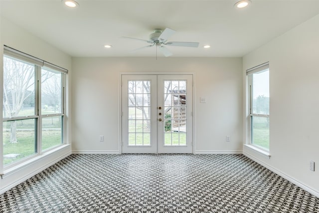 interior space featuring a wealth of natural light, french doors, and ceiling fan