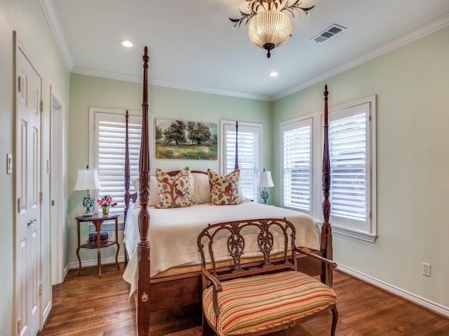 bedroom featuring ornamental molding and wood-type flooring