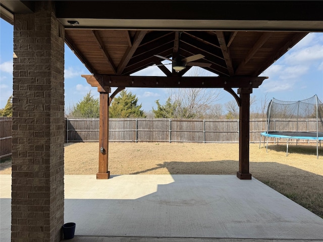 view of patio / terrace featuring a trampoline and a gazebo