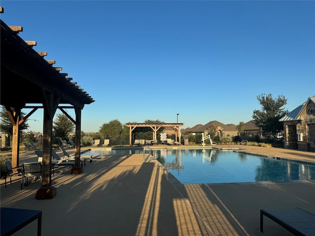 view of pool featuring a pergola and a patio area