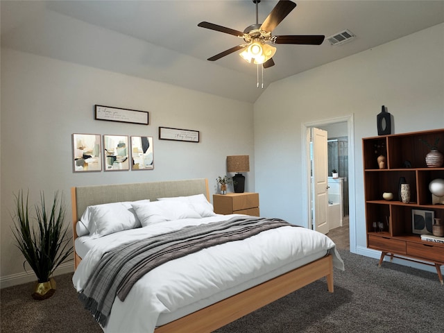 carpeted bedroom with vaulted ceiling, connected bathroom, and ceiling fan