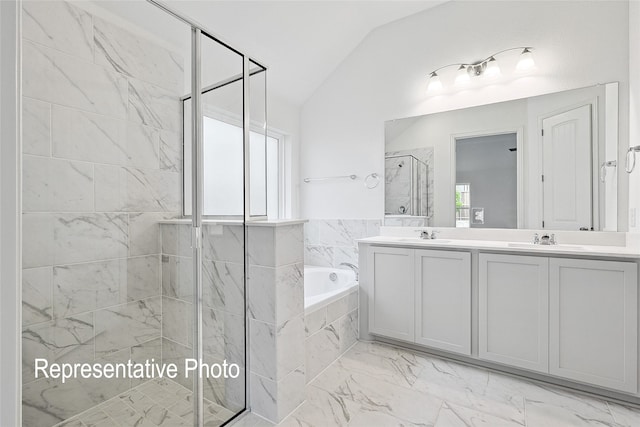 bathroom with plus walk in shower, lofted ceiling, and vanity