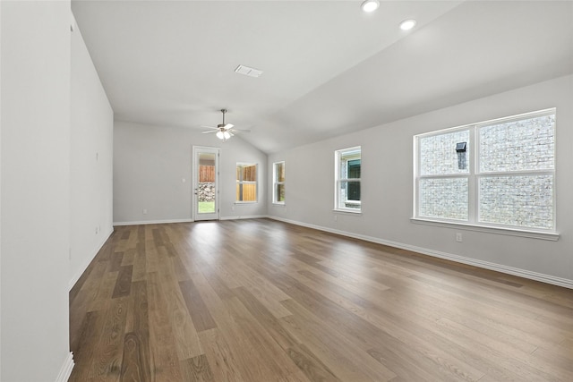 1432 Odette Dr, Arlington, TX 76013 - spare room featuring ceiling fan, wood finished floors, vaulted ceiling, and recessed lighting