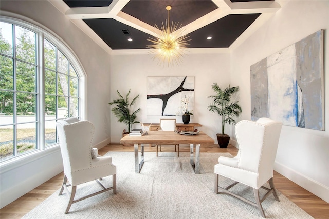 office area with baseboards, visible vents, coffered ceiling, wood finished floors, and a notable chandelier