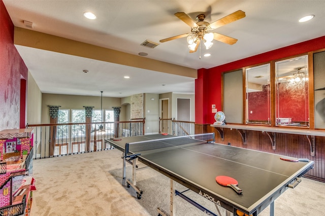 recreation room with carpet flooring