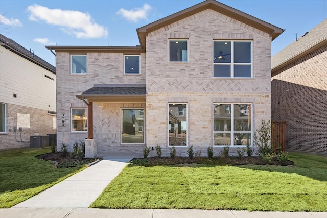 view of front facade featuring a front lawn, cooling unit, and brick siding