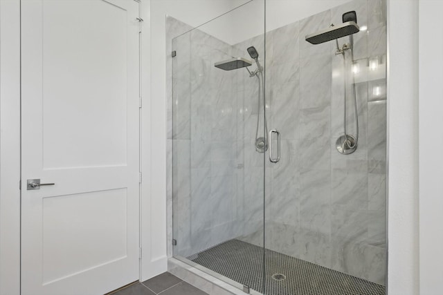 bathroom featuring a stall shower and tile patterned floors