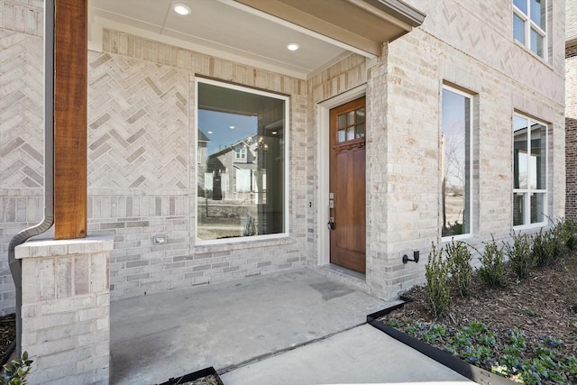 property entrance with brick siding