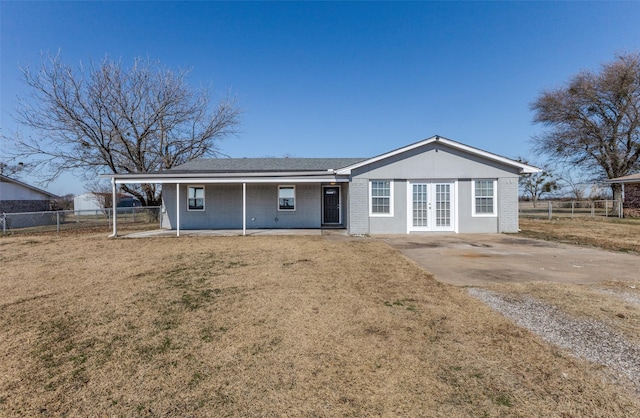 rear view of property with a yard and french doors