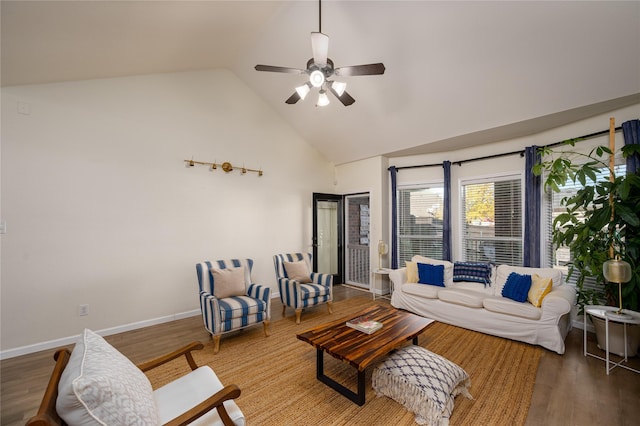 living room with hardwood / wood-style flooring, high vaulted ceiling, and ceiling fan