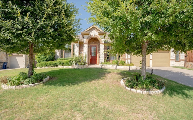 view of property hidden behind natural elements with a front lawn