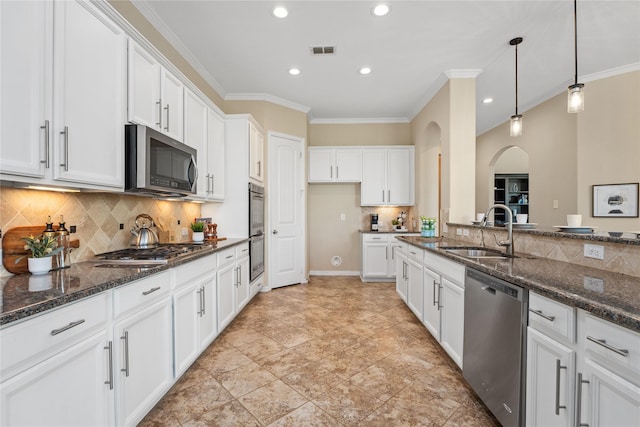 kitchen featuring sink, stainless steel appliances, and white cabinets